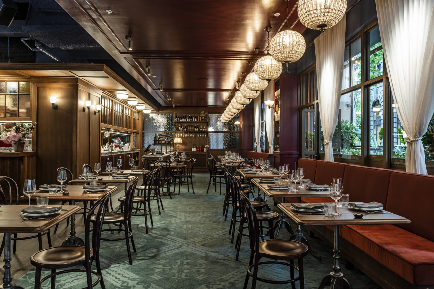 Bopp & Tone dining room with timber tables and globe lighting