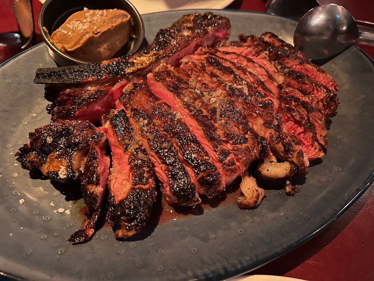 Sliced wood-grilled steak at Bopp & Tone